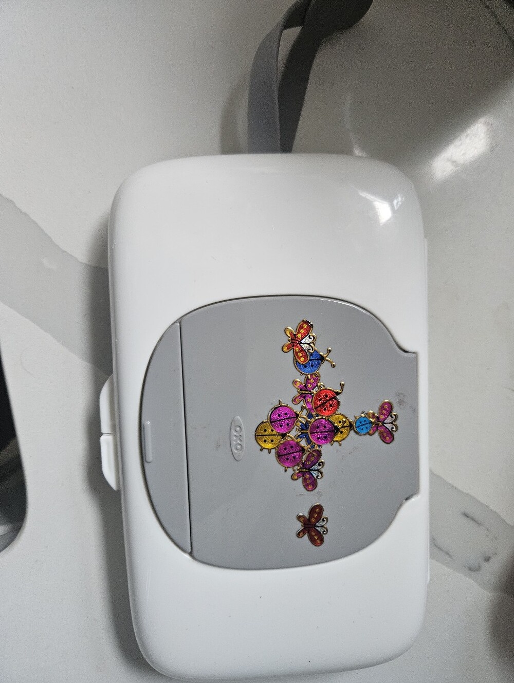 White and Gray Portable Wipes Dispenser with Decorative Sticker Oxo
